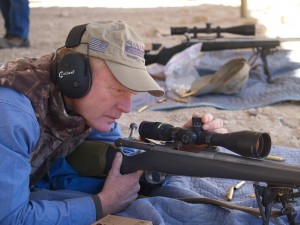 Craig Boddington with a scope on a rifle