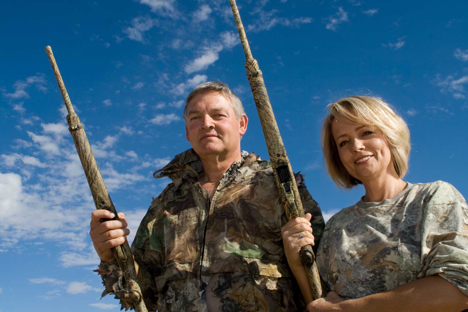 couple with shotguns